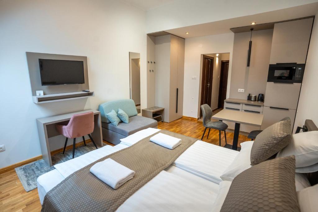 TV a/nebo společenská místnost v ubytování Végvár Spa Apartman