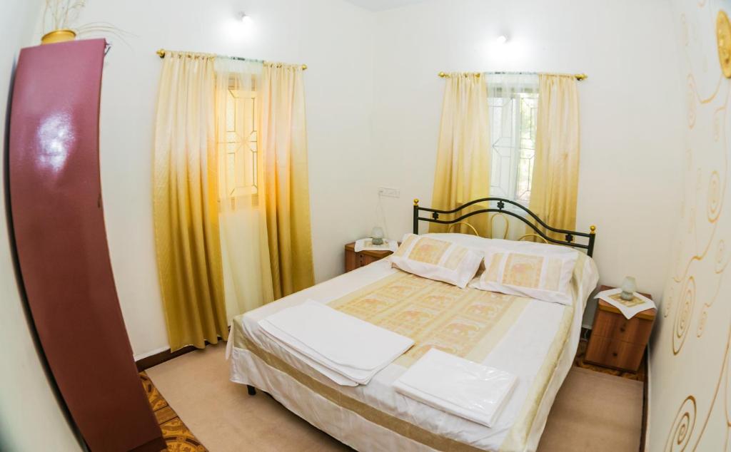 Postel nebo postele na pokoji v ubytování Orange Villa