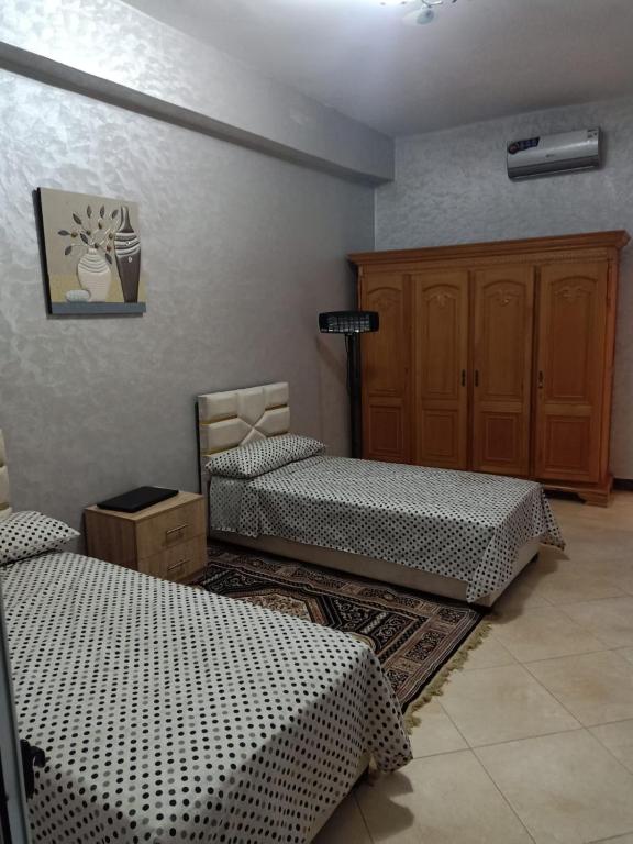 Postel nebo postele na pokoji v ubytování appartement équipé 3e étage