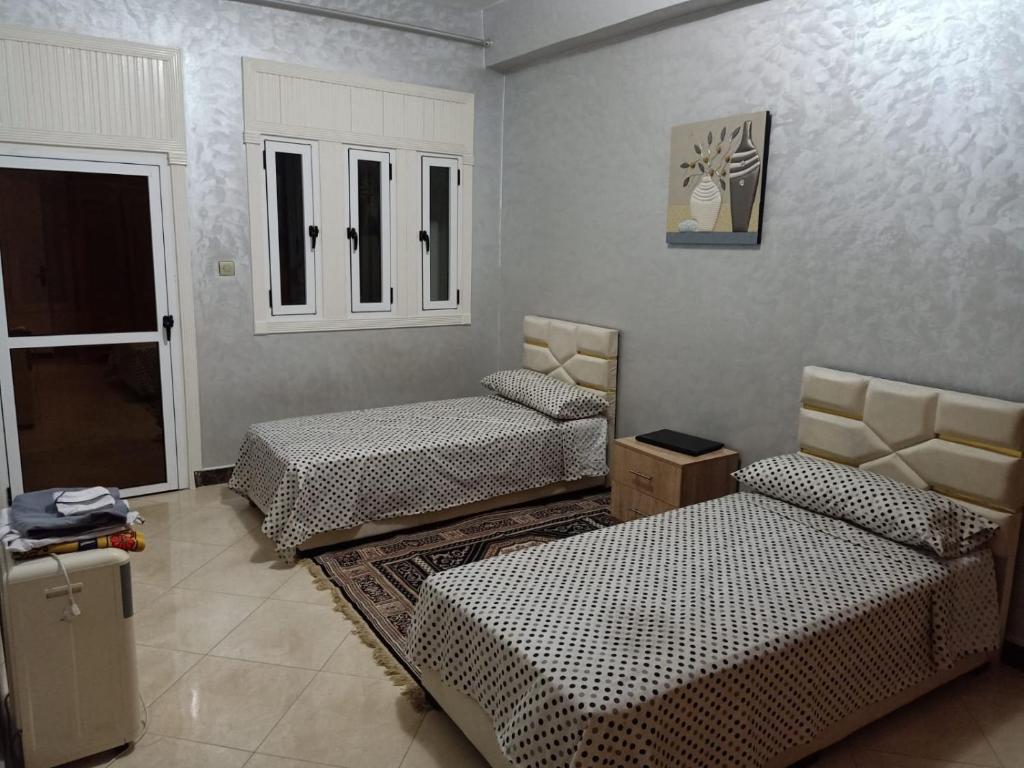 Postel nebo postele na pokoji v ubytování appartement équipé 3e étage