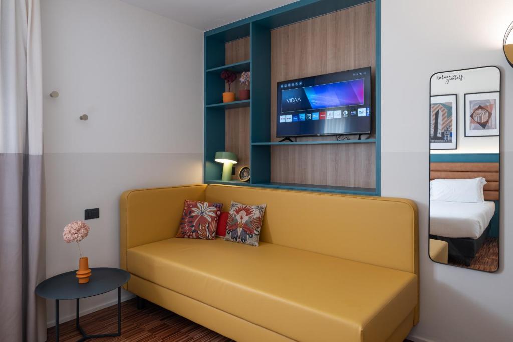 TV a/nebo společenská místnost v ubytování Bleis Hotel