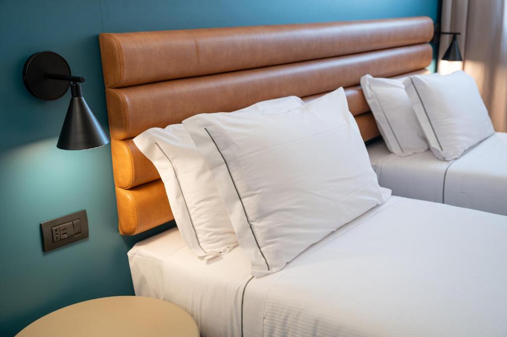 Postel nebo postele na pokoji v ubytování Bleis Hotel