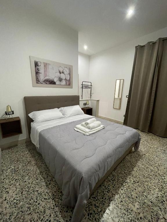 Postel nebo postele na pokoji v ubytování Kyansa Sicily a Pachino