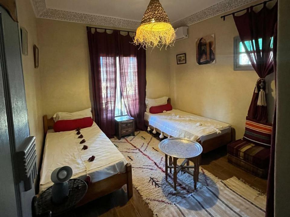 Postel nebo postele na pokoji v ubytování Le petit Jardin