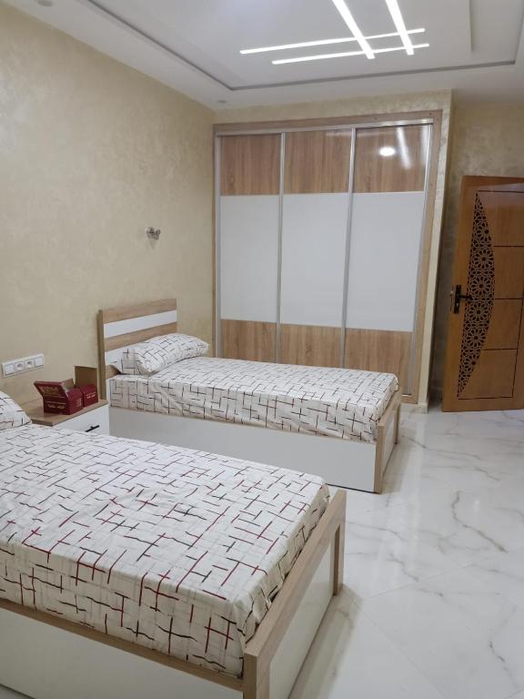 Postel nebo postele na pokoji v ubytování appartement équipé 2e étage
