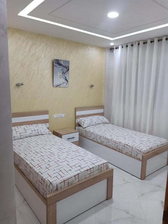 Postel nebo postele na pokoji v ubytování appartement équipé 2e étage