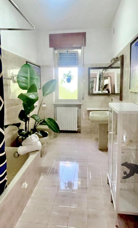 Televízia a/alebo spoločenská miestnosť v ubytovaní Villa Ettore