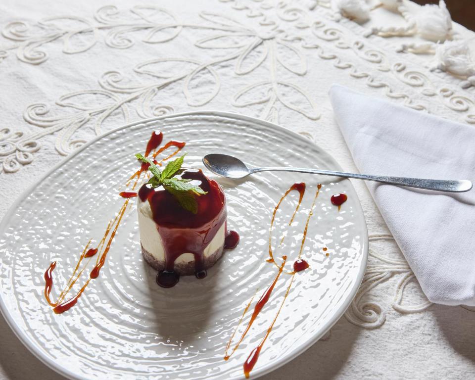 a dessert on a white plate on a table at La Casa E Il Mare, Private Bay Hotel in Mattinata