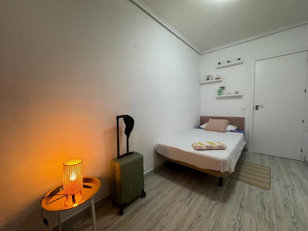 Postel nebo postele na pokoji v ubytování SuecaRoom