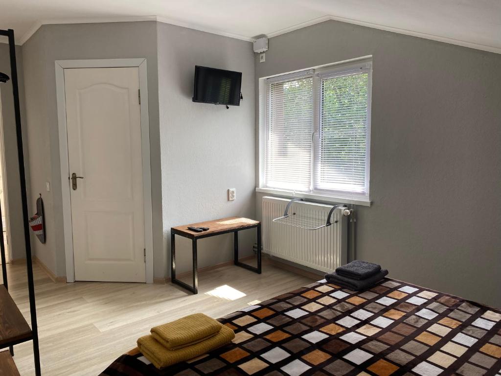 Postel nebo postele na pokoji v ubytování Mini-Hotel Serpanok