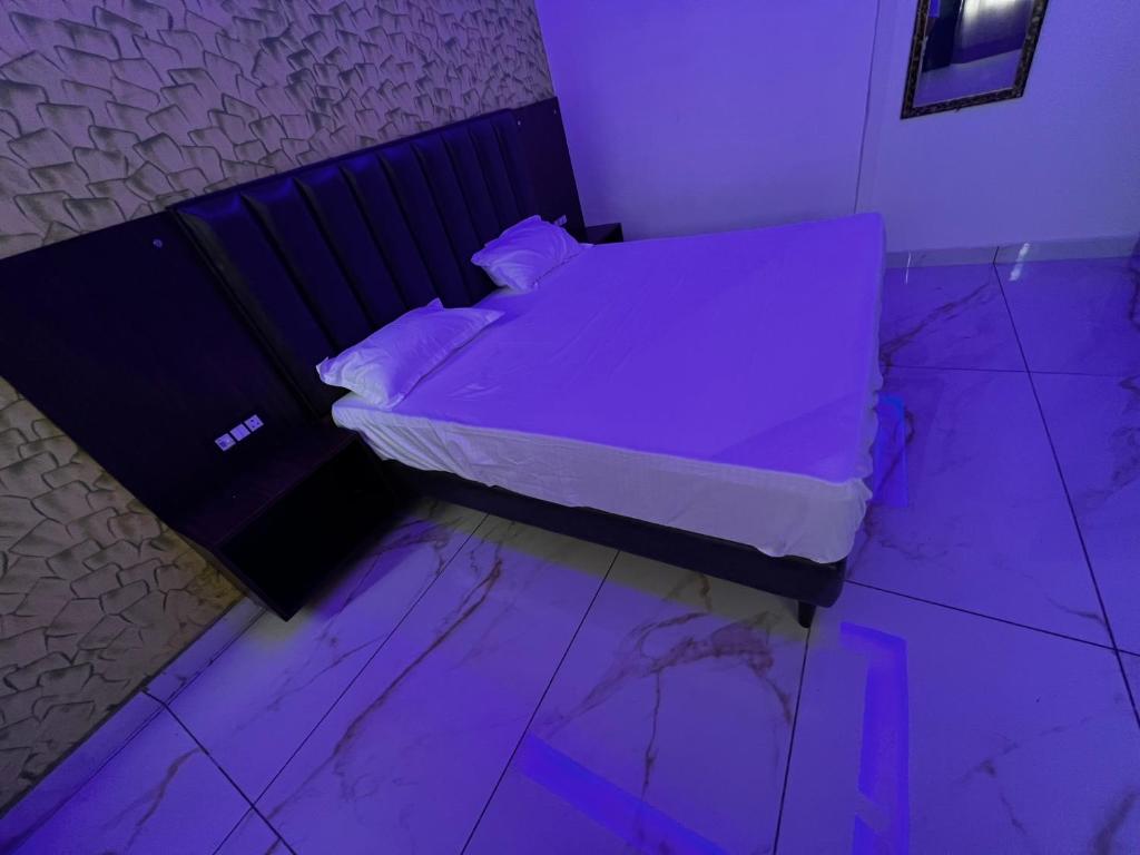 Postel nebo postele na pokoji v ubytování Hotel AJL