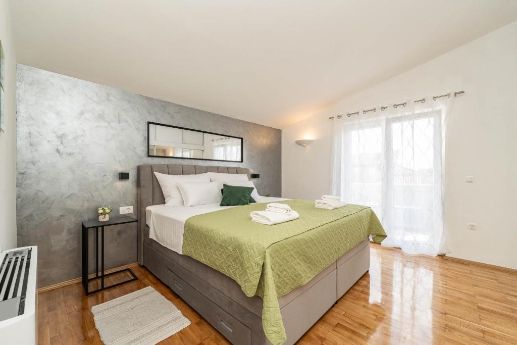 Postel nebo postele na pokoji v ubytování Apartments Dalmatia