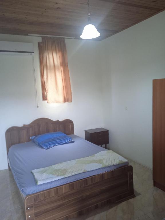 Postel nebo postele na pokoji v ubytování Hotel Poseidon