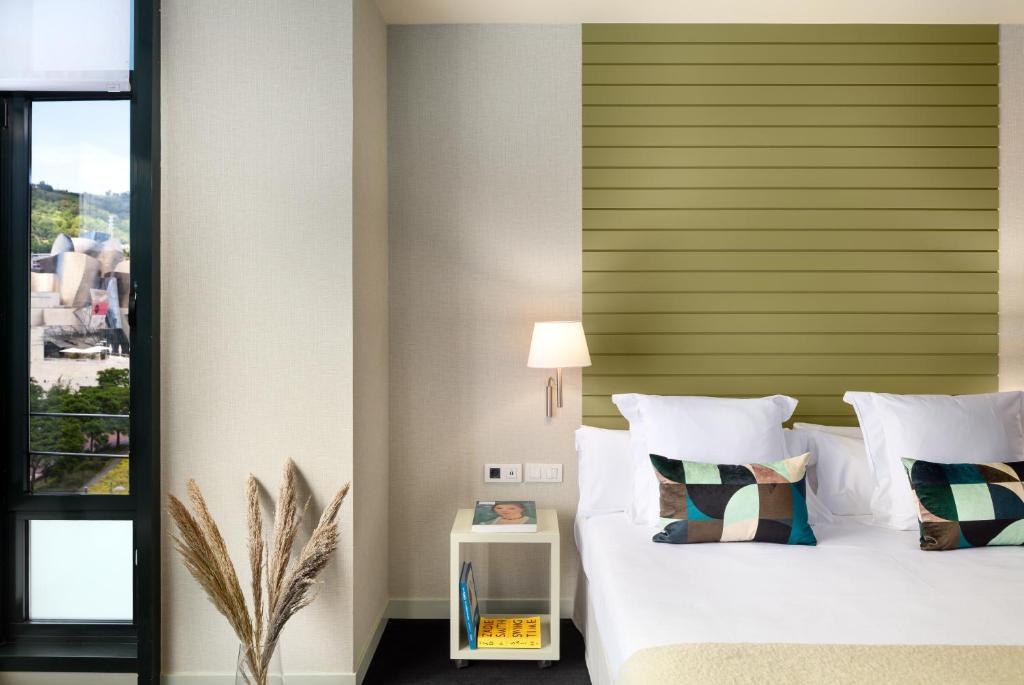 Postel nebo postele na pokoji v ubytování Hotel Miró