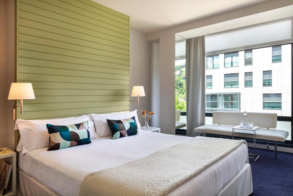Postel nebo postele na pokoji v ubytování Hotel Miró