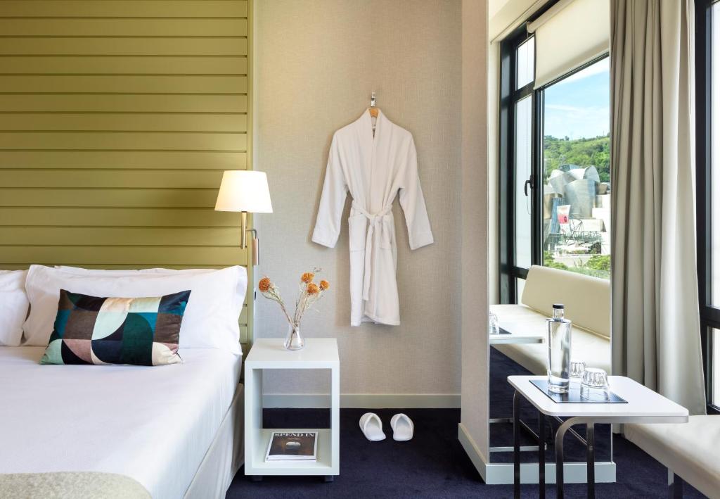 Postel nebo postele na pokoji v ubytování Hotel Miró