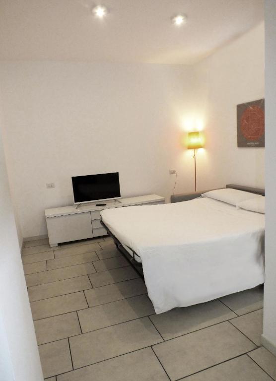 Postel nebo postele na pokoji v ubytování BB Hotels Aparthotel Visconti