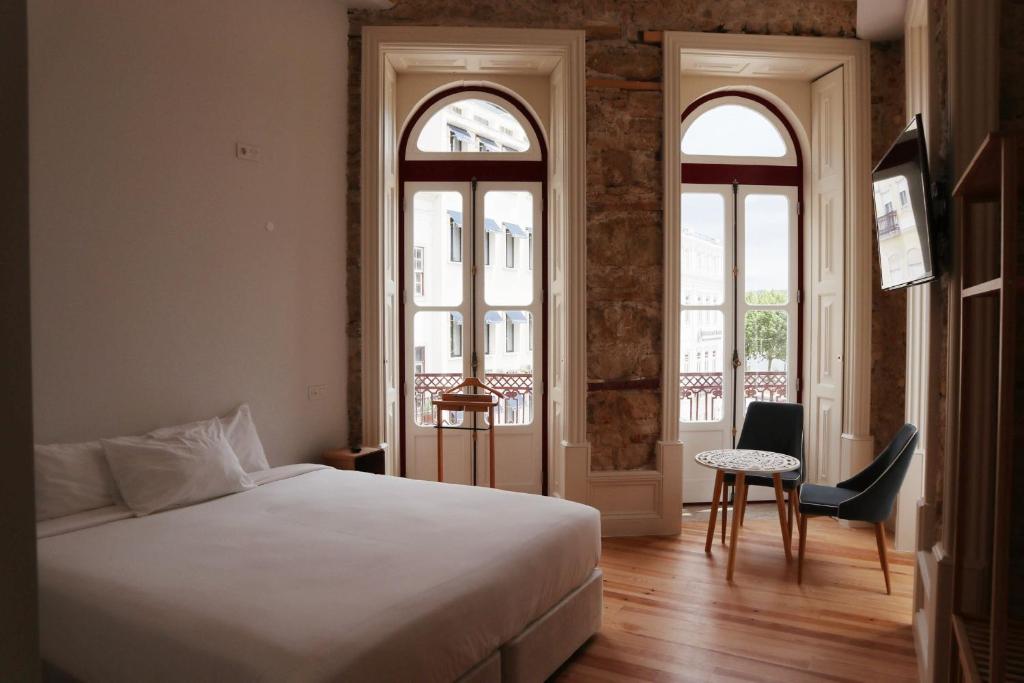 Postel nebo postele na pokoji v ubytování Casa da Portagem by PURUS