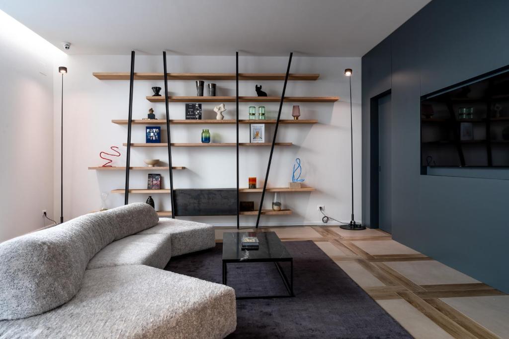 a living room with a couch and a table at Corte Novella Hotel & Residence in Brescia
