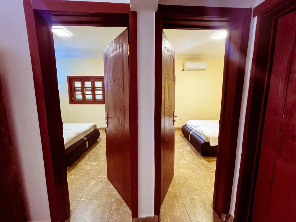 Postel nebo postele na pokoji v ubytování Tchada- Duplex