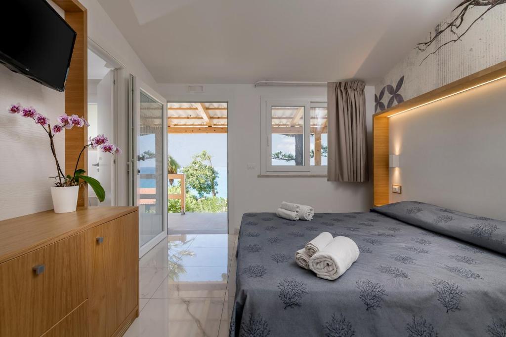 Postel nebo postele na pokoji v ubytování Hotel Villaggio Stromboli