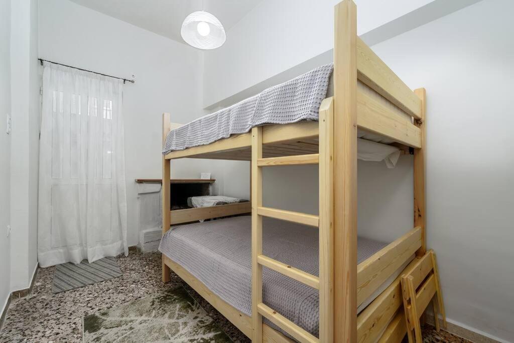 Postel nebo postele na pokoji v ubytování Aphrodites Place