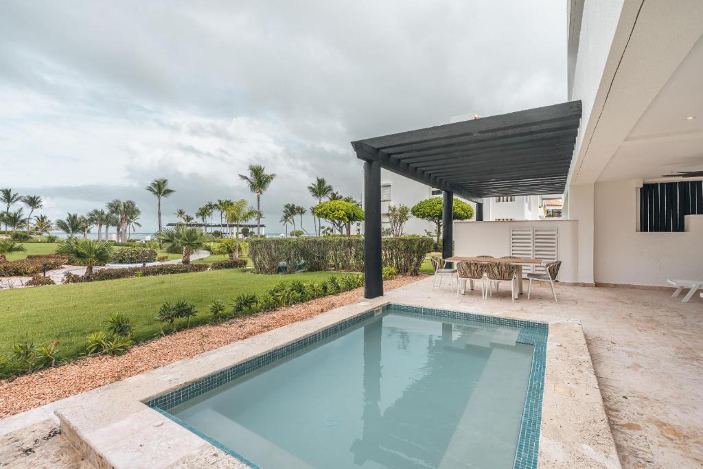 a swimming pool in the backyard of a house at Apt with picuzzi in Cap Cana at Punta Palmera BA5 in Punta Cana
