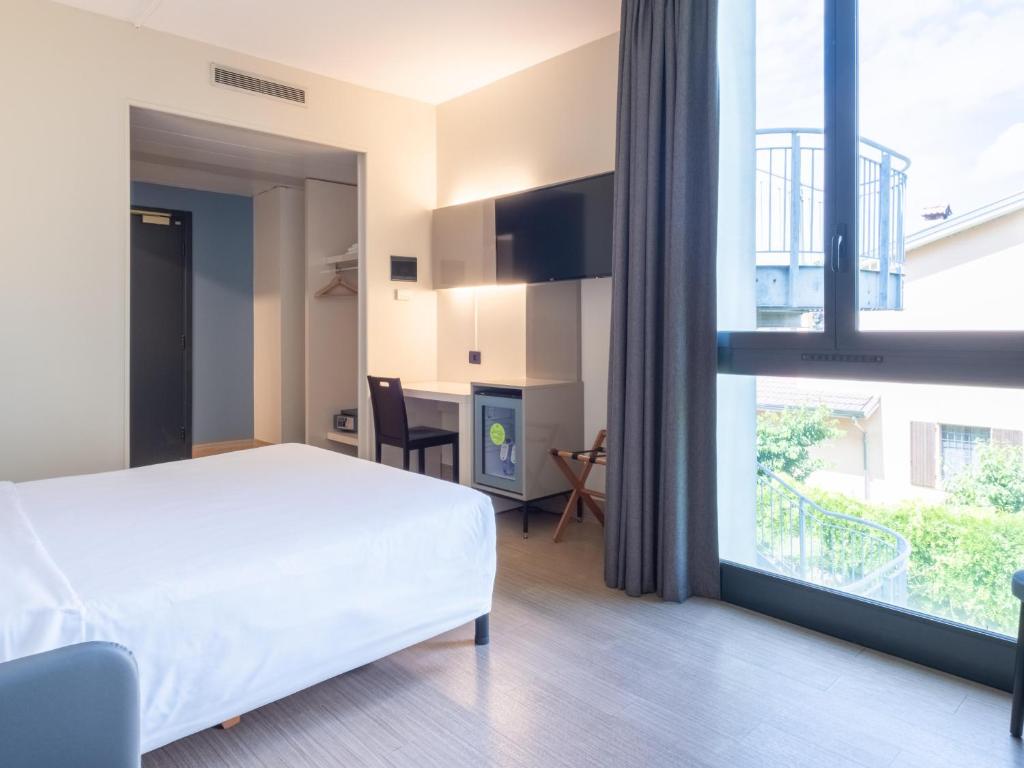 Postel nebo postele na pokoji v ubytování B&B HOTEL Mantova