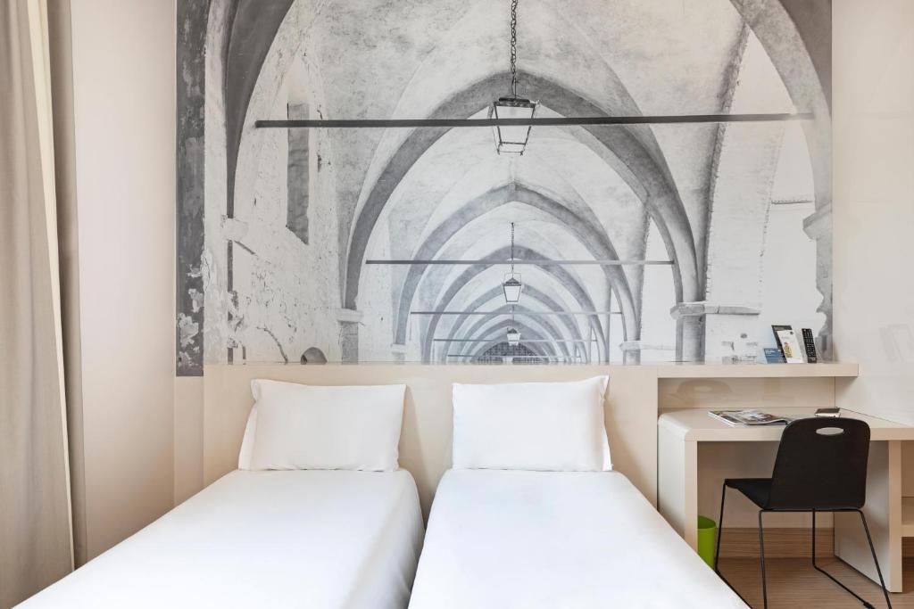 Postel nebo postele na pokoji v ubytování B&B Hotel Bergamo City