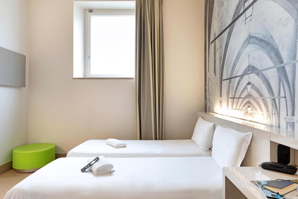 Postel nebo postele na pokoji v ubytování B&B Hotel Bergamo City