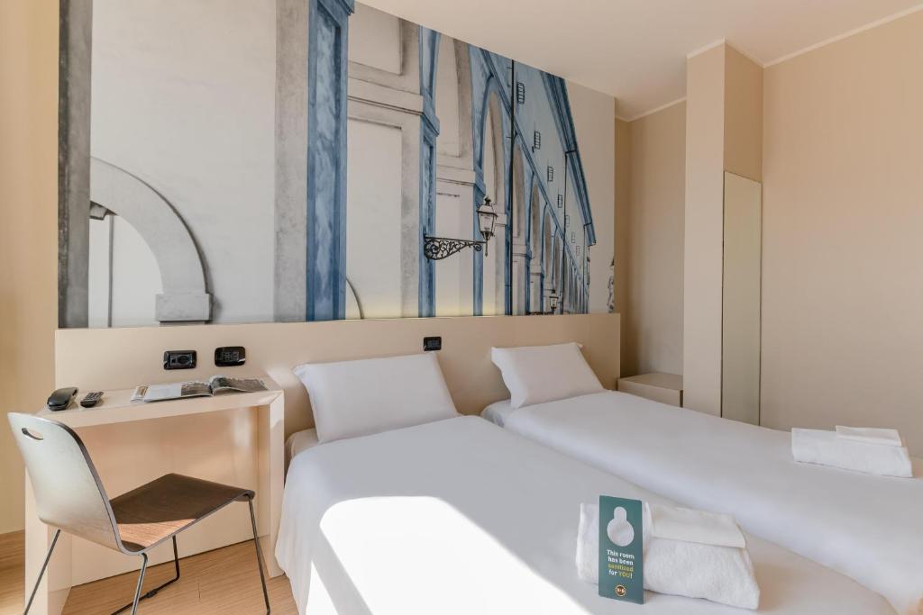 Postel nebo postele na pokoji v ubytování B&B Hotel Firenze City Center