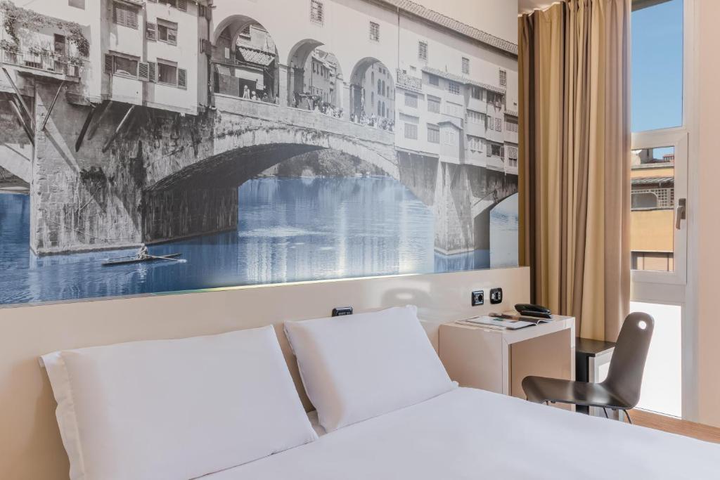 Postel nebo postele na pokoji v ubytování B&B Hotel Firenze City Center