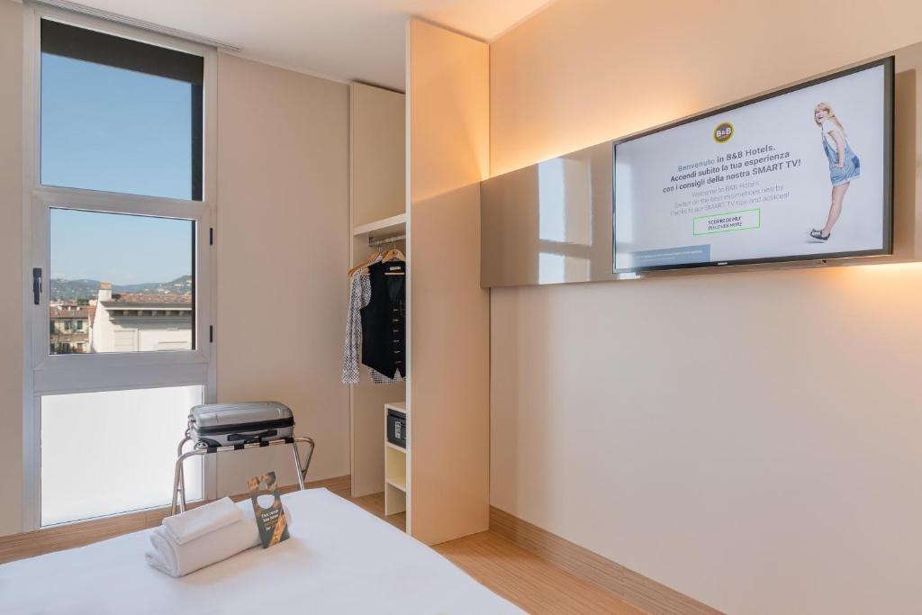 TV a/nebo společenská místnost v ubytování B&B Hotel Firenze City Center