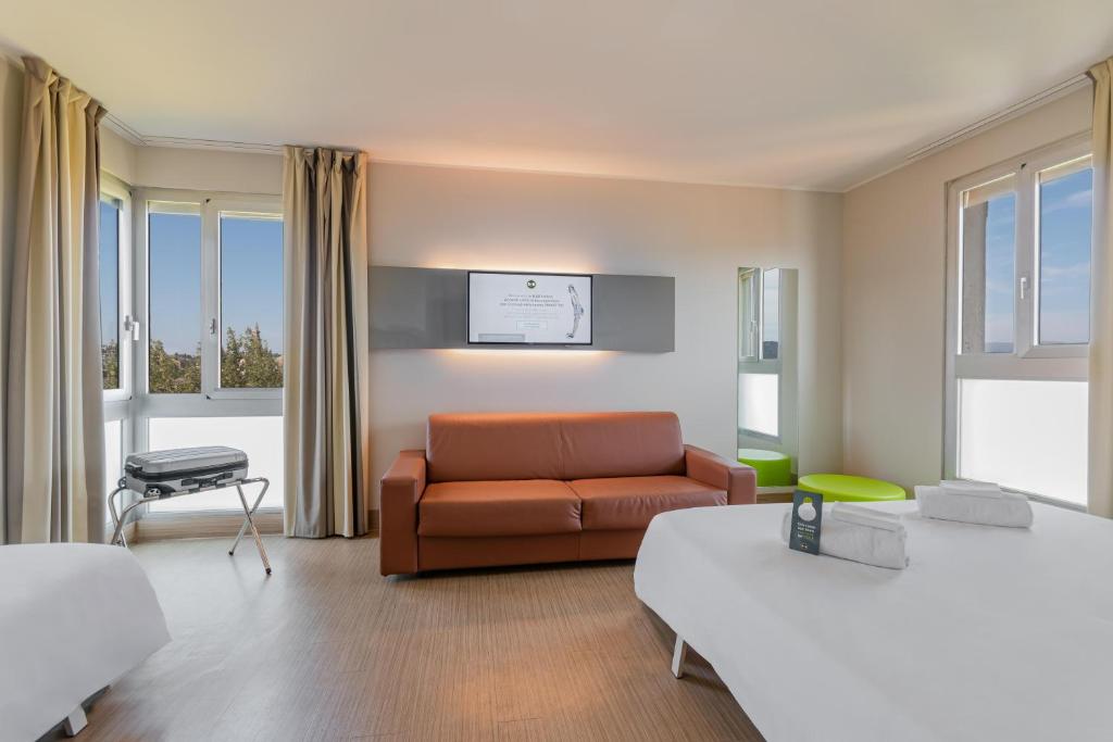 Postel nebo postele na pokoji v ubytování B&B Hotel Firenze City Center