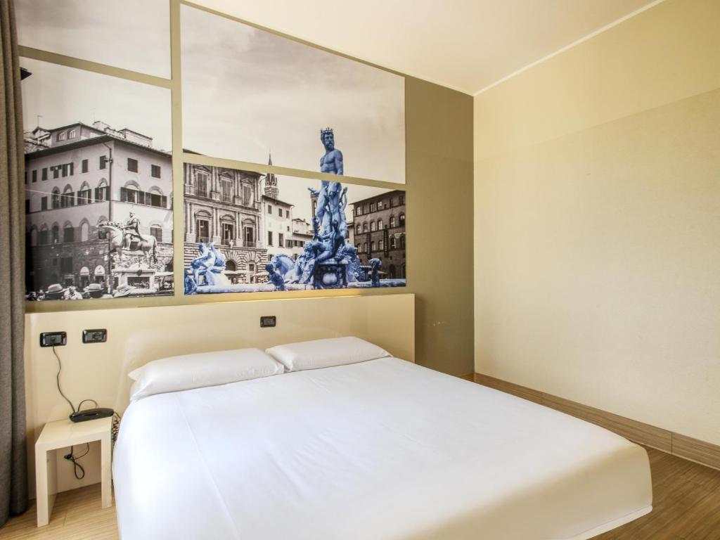 Postel nebo postele na pokoji v ubytování B&B Hotel Firenze Novoli