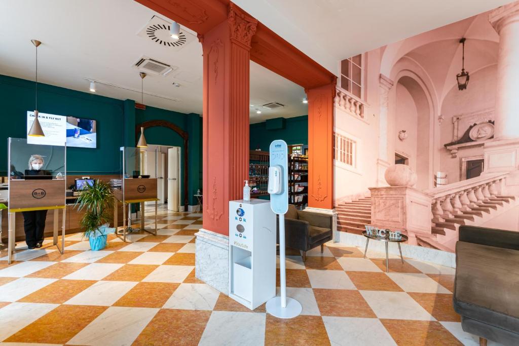 TV a/nebo společenská místnost v ubytování B&B Hotel Genova Principe