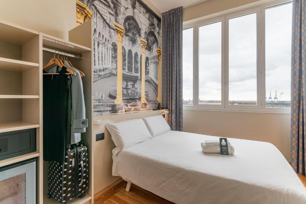 Postel nebo postele na pokoji v ubytování B&B Hotel Genova Principe