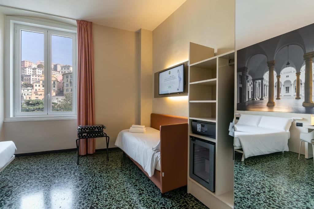 Postel nebo postele na pokoji v ubytování B&B Hotel Genova Principe