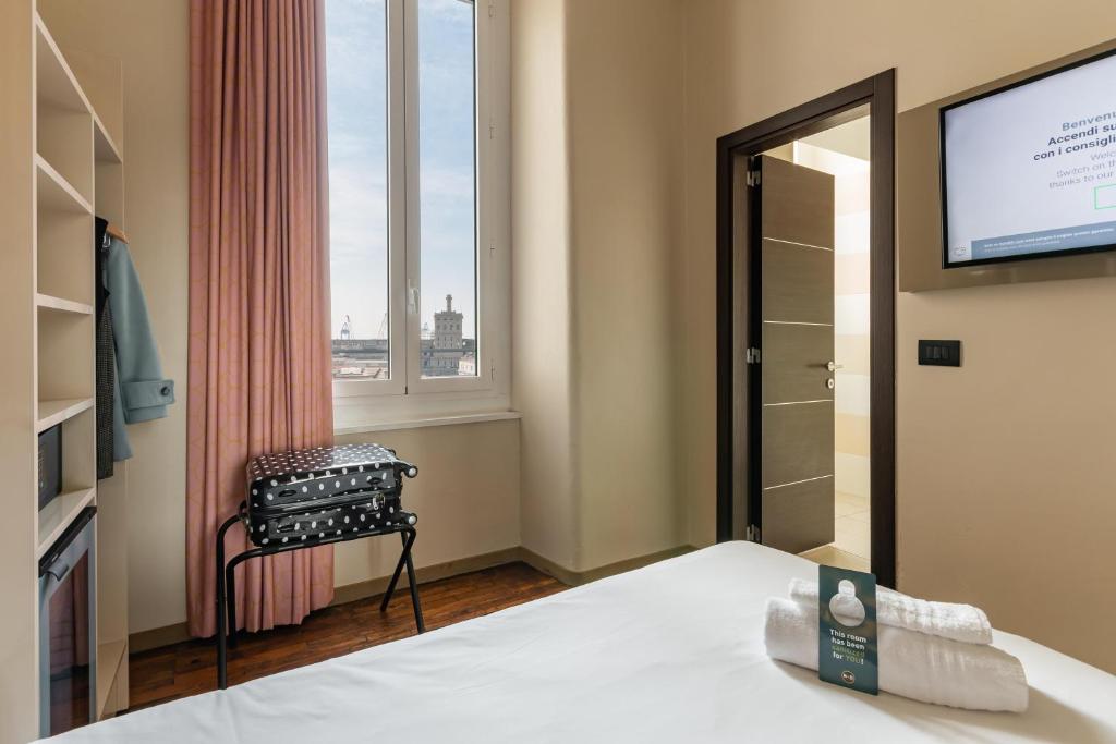Postel nebo postele na pokoji v ubytování B&B Hotel Genova Principe