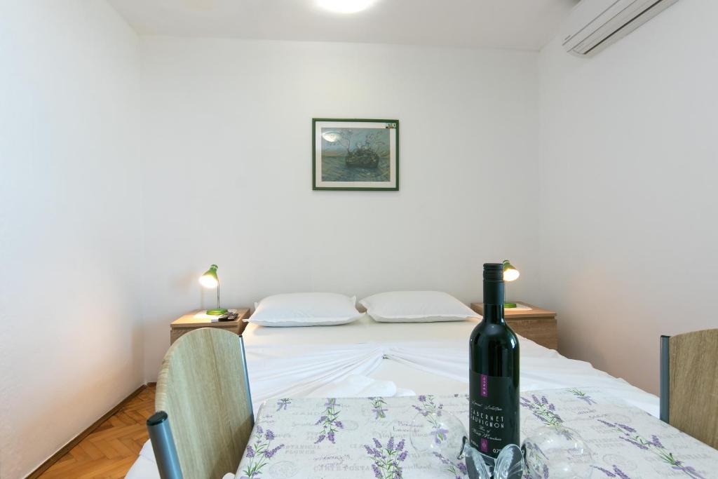 Posteľ alebo postele v izbe v ubytovaní Holiday Apartments Stomarica
