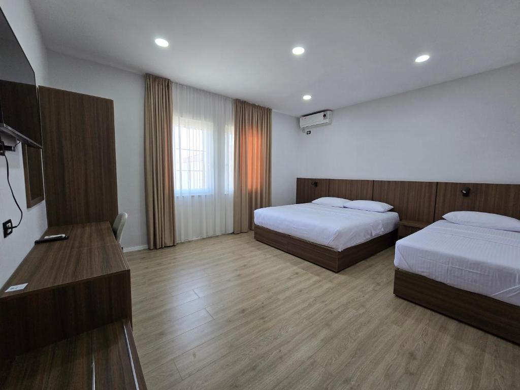 Llit o llits en una habitació de Hotel Aleks
