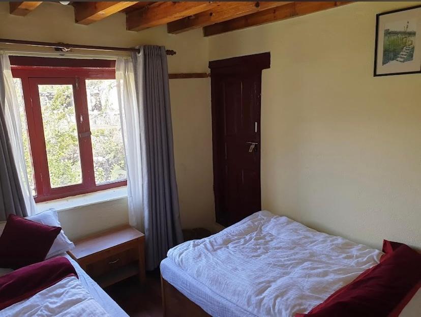Postel nebo postele na pokoji v ubytování Paradise Trekkers Home