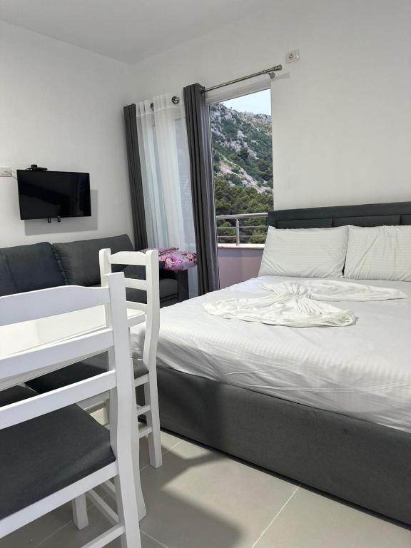 Postel nebo postele na pokoji v ubytování Tafi Appart Hotel & Art Space