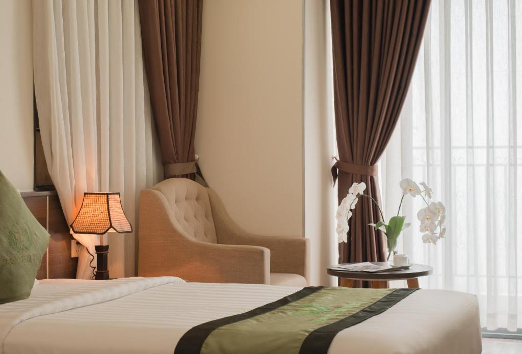 Giường trong phòng chung tại BN Boutique Nha Trang Beach
