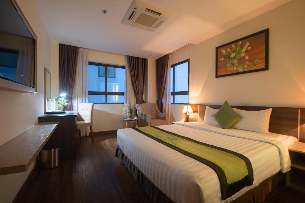Postel nebo postele na pokoji v ubytování BN Boutique Nha Trang Beach