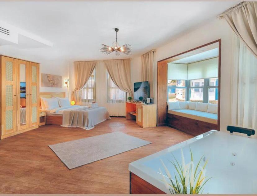 A bed or beds in a room at Triangulo Hotel