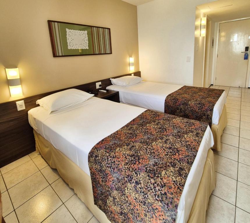 Postel nebo postele na pokoji v ubytování Hotel Sonata de Iracema