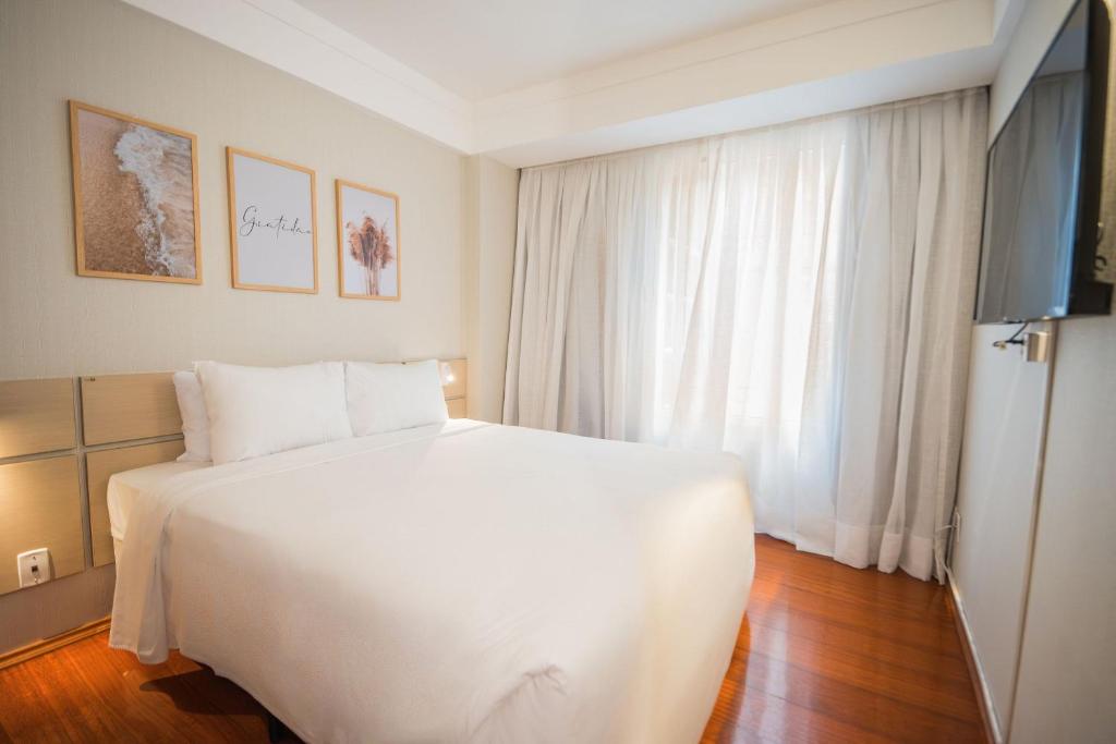 Postel nebo postele na pokoji v ubytování Xtay Guarulhos Aeroporto - Aconchegante e a 16min do Aeroporto