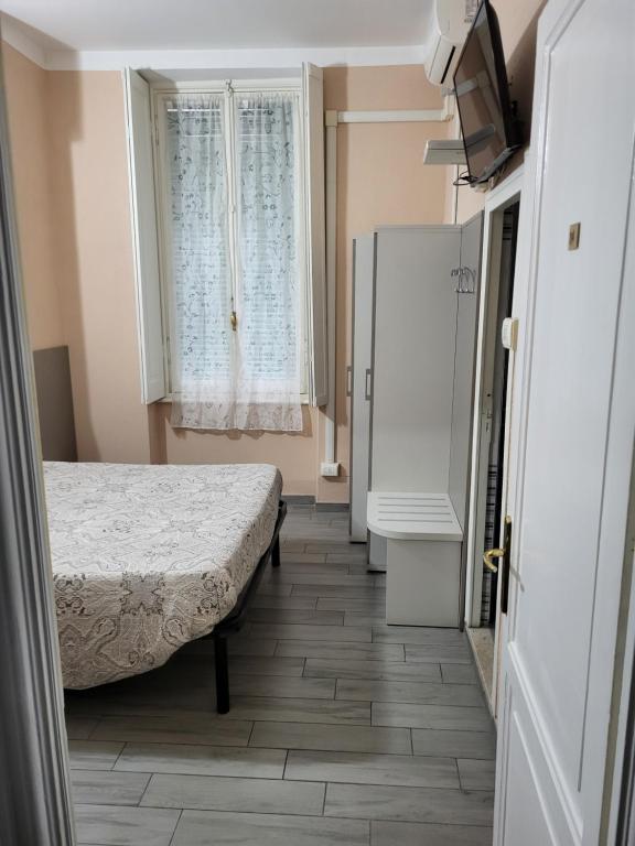 Postel nebo postele na pokoji v ubytování Hotel Barone