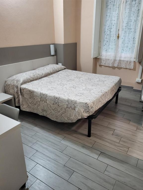 Postel nebo postele na pokoji v ubytování Hotel Barone